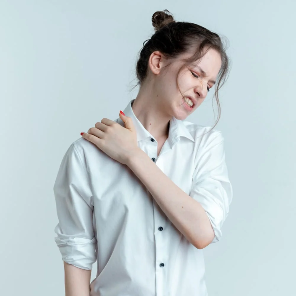 A patient shoulder being assessed during a ChiroMed examination